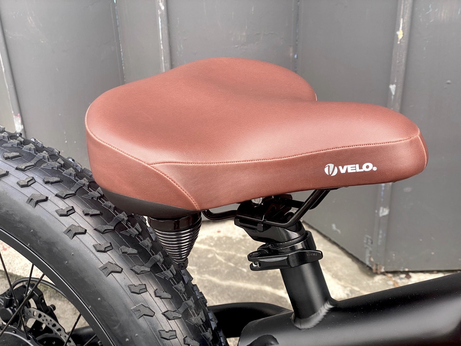 The Scout Electric Motorbike from Boostbikes. Classic Black and Tan detailing, matt black frame with tan vegan leather seat, tank and grips with Kenda All Terrain tyres. Front Suspension available as an option.